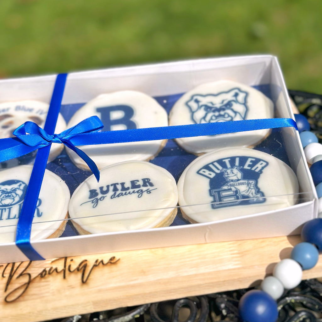 Box of cookies with 'Butler' branding on a grassy background
