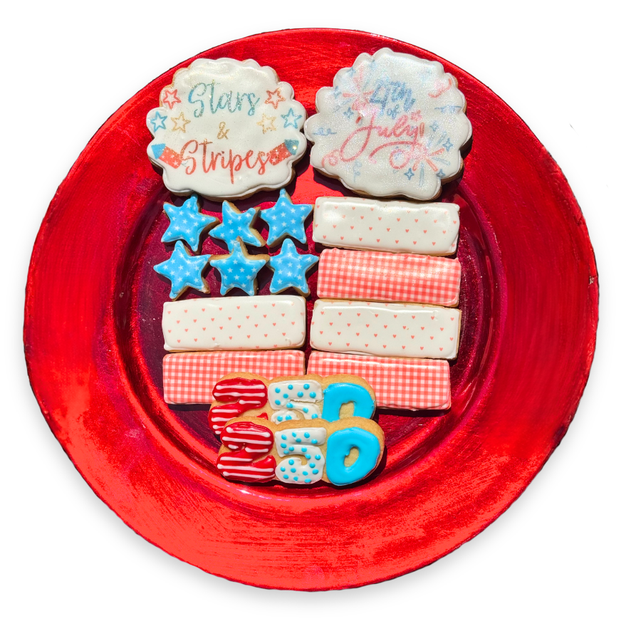 Decorative cookies on a red plate with 'Stars & Stripes' and '4th of July' text.